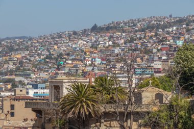 Valparaiso, Chile - Dec 5, 2022: Colorful houses in a poor neighborhood of Valparaiso, which has been declared as a World Heritage Site by UNESCO