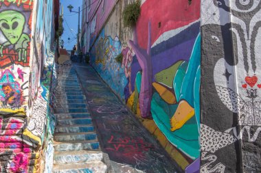 Valparaiso, Chile - Dec 5, 2022: Stairs with graffiti on a steep street of Valparaiso, which has been declared as a World Heritage Site by UNESCO