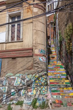 Valparaiso, Chile - Dec 5, 2022: Stairs with graffiti on a steep street of Valparaiso, which has been declared as a World Heritage Site by UNESCO