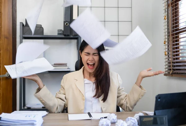 stock image Stressed tired businesswoman feels exhausted sitting at office desk with laptop and crumpled paper, frustrated woman can not concentrate having writers block, lack of new ideas or creative crisis