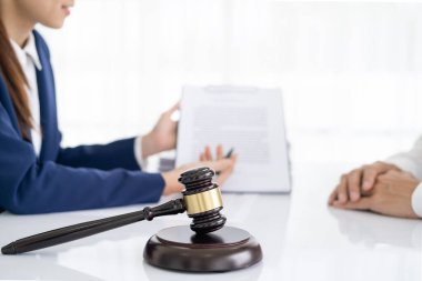 Professional Female lawyer or counselor discussing negotiation legal case with client meeting with document contract in office, law and justice, attorney, lawsuit concept.
