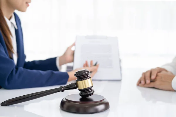 Professional Female lawyer or counselor discussing negotiation legal case with client meeting with document contract in office, law and justice, attorney, lawsuit concept.