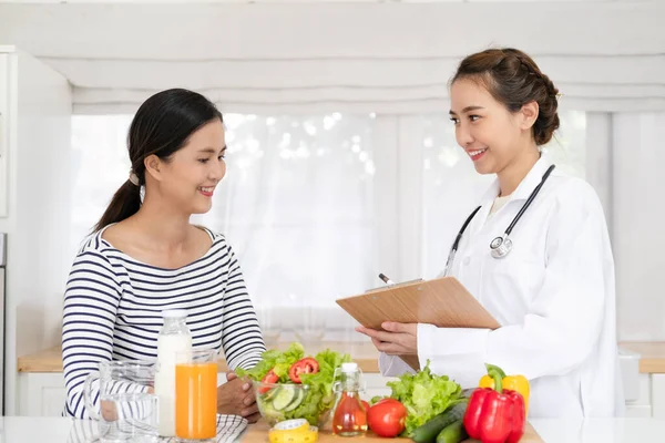 Nutritionist giving consultation to patient with healthy fruit and vegetable  Right nutrition and diet concept