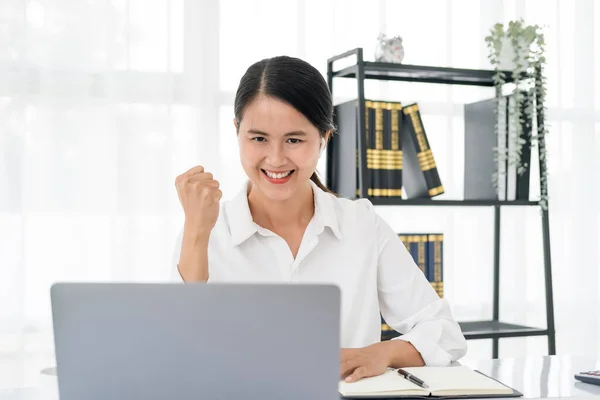 smiling beautiful business asian woman working in office use computer with copy space. Business owner people sme freelance online marketing e-commerce telemarketing, work from home concept