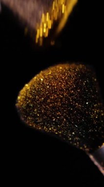 Vertical Screen: Makeup Brushes Touch Each Other on Dark Background and Small Particles of Cosmetics, Beauty Concept Super Slow Motion Content Shot for Social Media. High quality footage
