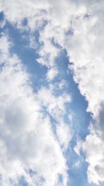 Vertical Screen: Blue Sky with White Fluffy Clouds. Clear and Good Weather in Time Lapse. Beautiful Summer Landscape In Clean Atmosphere. Shot for Social Media. High quality footage