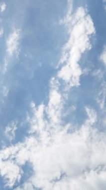 Vertical Screen: Blue Sky with White Fluffy Clouds. Clear and Good Weather in Time Lapse. Beautiful Summer Landscape In Clean Atmosphere. Shot for Social Media. High quality footage