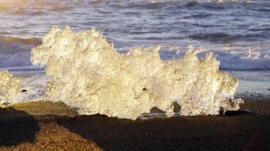 Ice Chunks On Black Volcanic Beach in Iceland Nature. High quality 4k footage