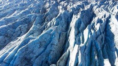 Vatnajokull Glacier in Iceland, Pure Blue Ice at Winter Season, Aerial View.