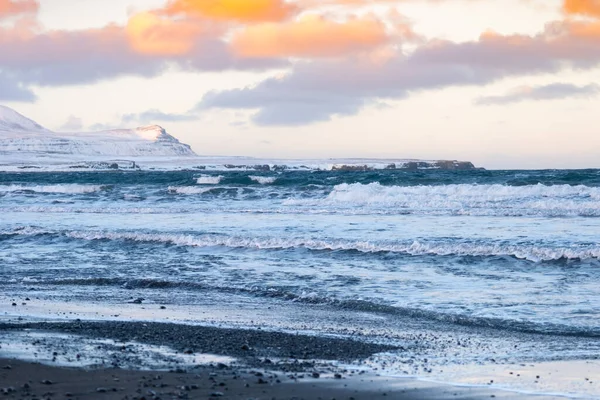 Icelandic Fjords During Sunset. Ocean Coast With Snow Covered Mountains. Winter Landscape in the North Europe Country. Landscape in Iceland.