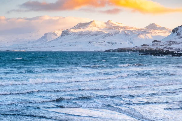 Icelandic Fjords During Sunset. Ocean Coast With Snow Covered Mountains. Winter Landscape in the North Europe Country. Landscape in Iceland.