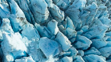 Vatnajokull Glacier in Iceland, Pure Blue Ice at Winter Season, Aerial View.