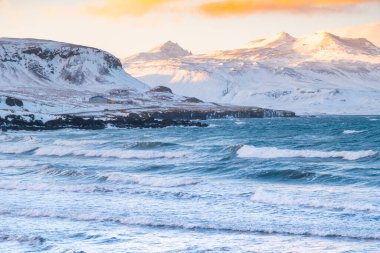 Icelandic Fjords During Sunset. Ocean Coast With Snow Covered Mountains. Winter Landscape in the North Europe Country. Landscape in Iceland.