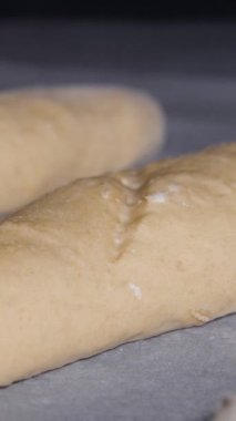 Vertical screen: Warm fresh bread in a bakery. Making bread and eco production. Dough Rises Fast. Cooking process in Time Lapse. Baking Italian bio bread in oven. High quality footage.