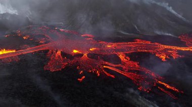 Volcano eruption in 2023, Red burning lava erupts from the ground in Iceland. Formation of a new active volcano. Aerial footage. High quality 4k footage