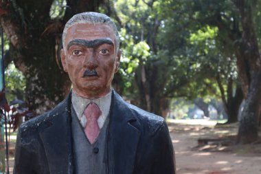 Taubate, Sao Paulo, Brasil - October 11, 2022: statue of Monteiro Lobato brazilian writer, with unknown authorship at Yellow Woodpecker Park, sitio do pica pau amarelo, Taubate, Brazil clipart