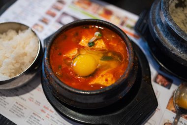 Sundubu tofu stew with Korean spicy paste - Korean food style clipart