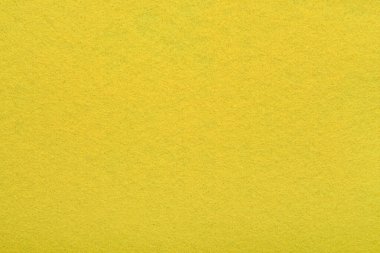 Sarı keçeli kumaş arka plan - yumuşak kumaş yüzeyinin yakın çekimi. Kusursuz arkaplan, grafik tasarımı, yapıştırma kitabı, tekstil düzeni, yaratıcı projeler.
