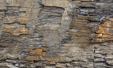 Old Aged Shabby Cliff Face And Divided By Huge Cracks And Layers clipart