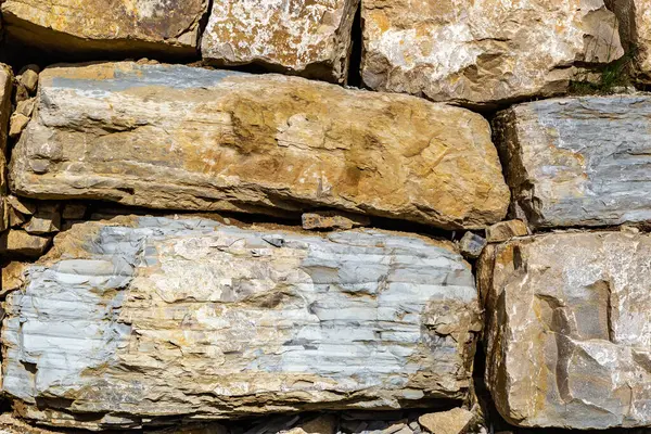 stock image Stone wall fence in daylight. Banner background, backdrop or texture.