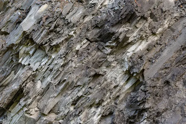 stock image Old Aged Shabby Cliff Face And Divided By Huge Cracks And Layers