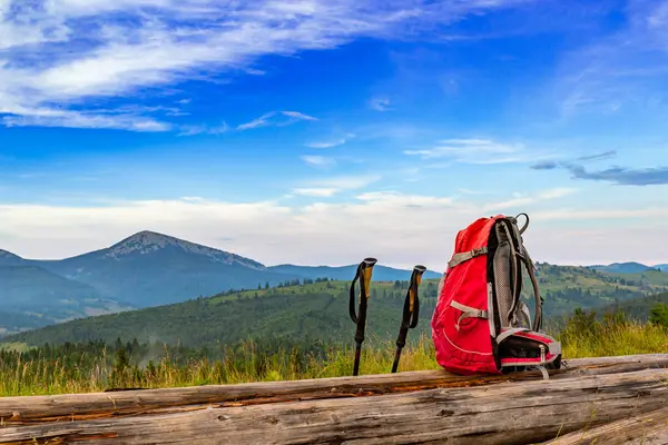 stock image Trekking with a backpack and trekking poles along the ridge in the mountains.