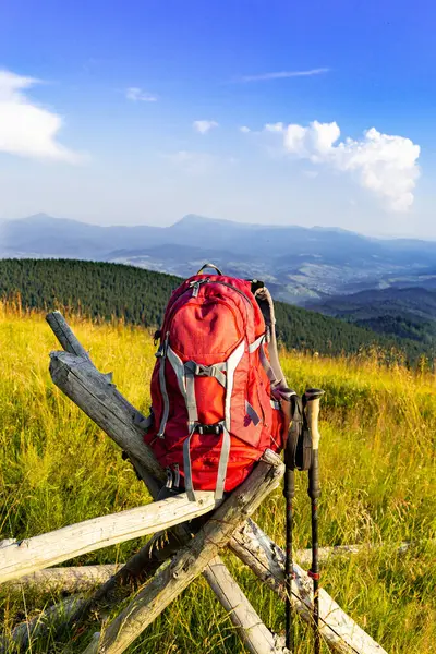 stock image Hiking backpack with trekking poles for mountain hiking.