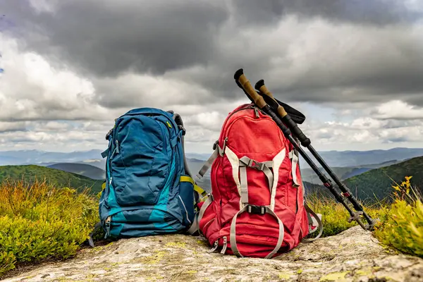 stock image Mountain landscape with peaks and backpacking equipment.