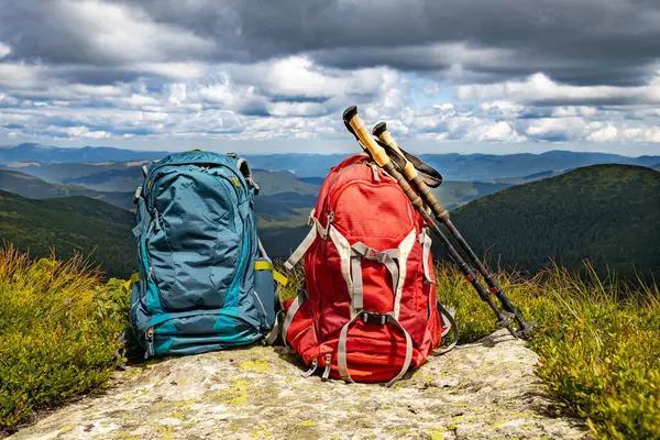 stock image Mountain landscape with peaks and backpacking equipment.