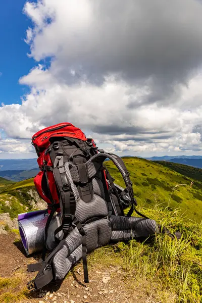 stock image Hiking high in the mountains with a backpack