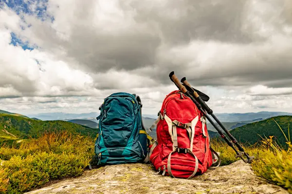 stock image Mountain landscape with peaks and backpacking equipment.