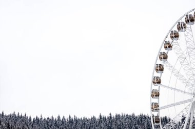 Ferris wheel with beautiful lighting in Bukovel. clipart