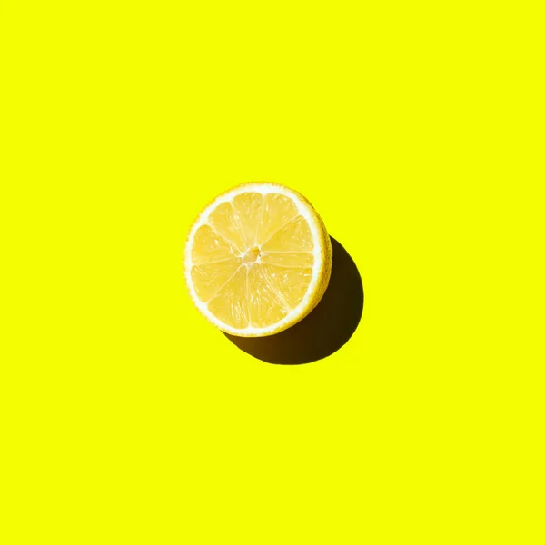 stock image Fresh cut lemon lies on a yellow background isolate top view