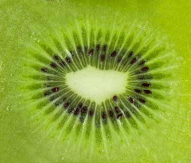 Yeşil kivi kesimi şeklinde arkaplan kapat