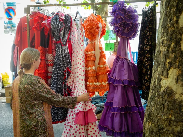 stock image Young white caucasian woman looking at things in Madrid Rastro street market