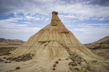 Bardenas Reales Natural Park, an extensive desert region located in the province of Navarra, with imposing canyons, limestone cliffs and rocky outcrops clipart