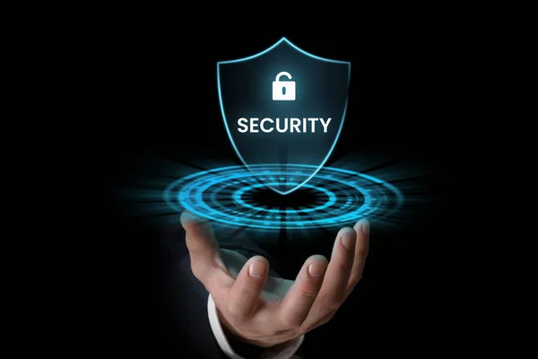 Businessman holding digital security icon in the hand, internet security concept.