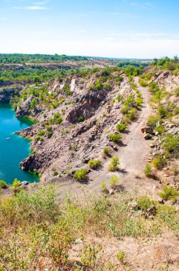 Landscape overlooking a stone quarry filled with water