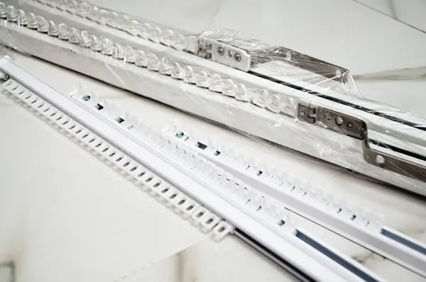 stock image Automatic cornices for curtains in white. Accessories for curtains.