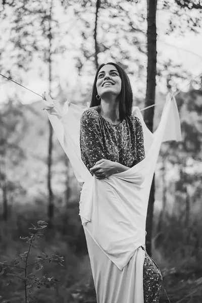 attractive young woman in stylish clothes with long hair, walking in autumn park