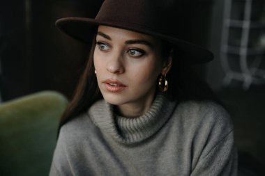 portrait of a beautiful woman on the street. photo on her face