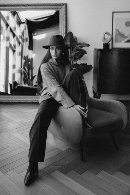 young beautiful lady posing in retro interior