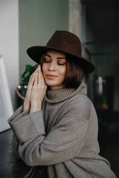 portrait of beautiful young girl with hat and stylish make-up