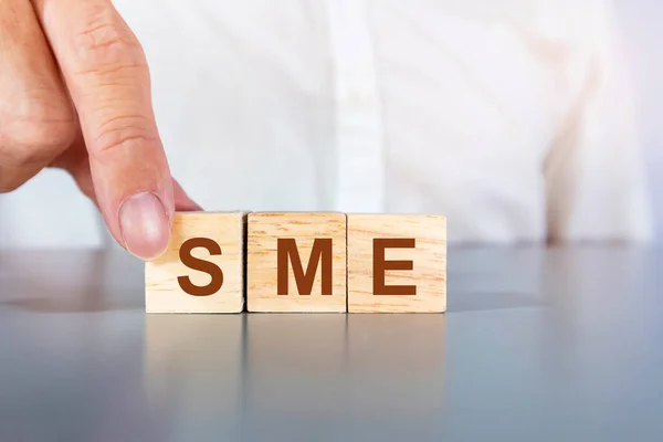 Stock image SME letters on a wooden box,small business entrepreneurs