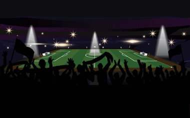 Stadyumda siluetler içinde spor için tezahürat yapan seyirciler geceleri parlayan ışıklar, gölgelerde duran pervaneler ve koltuklardan bayrak sallayan izleyicilerle futbol sahası aydınlatılıyor.