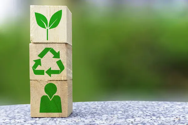 People collaboration to reuse and recycle for the sake of the environment ,Environmental protection and green nature,icon on wooden box and light green background