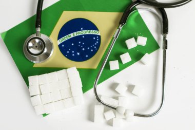 Brezilya 'da tıbbi steteskop ve sağlık hizmeti ile şeker küpü arkaplan resmi.