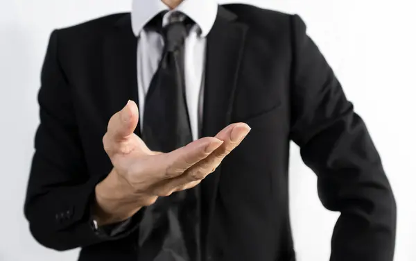 stock image Businessman in black suit standing showing confidence in business and vision for work