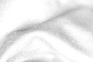 Beyaz kumaş kırışıklıkları, beyaz ışık ve kumaşın kaba dokusu.