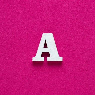 Alphabet letter A - White wooden letter on rhodamine red background